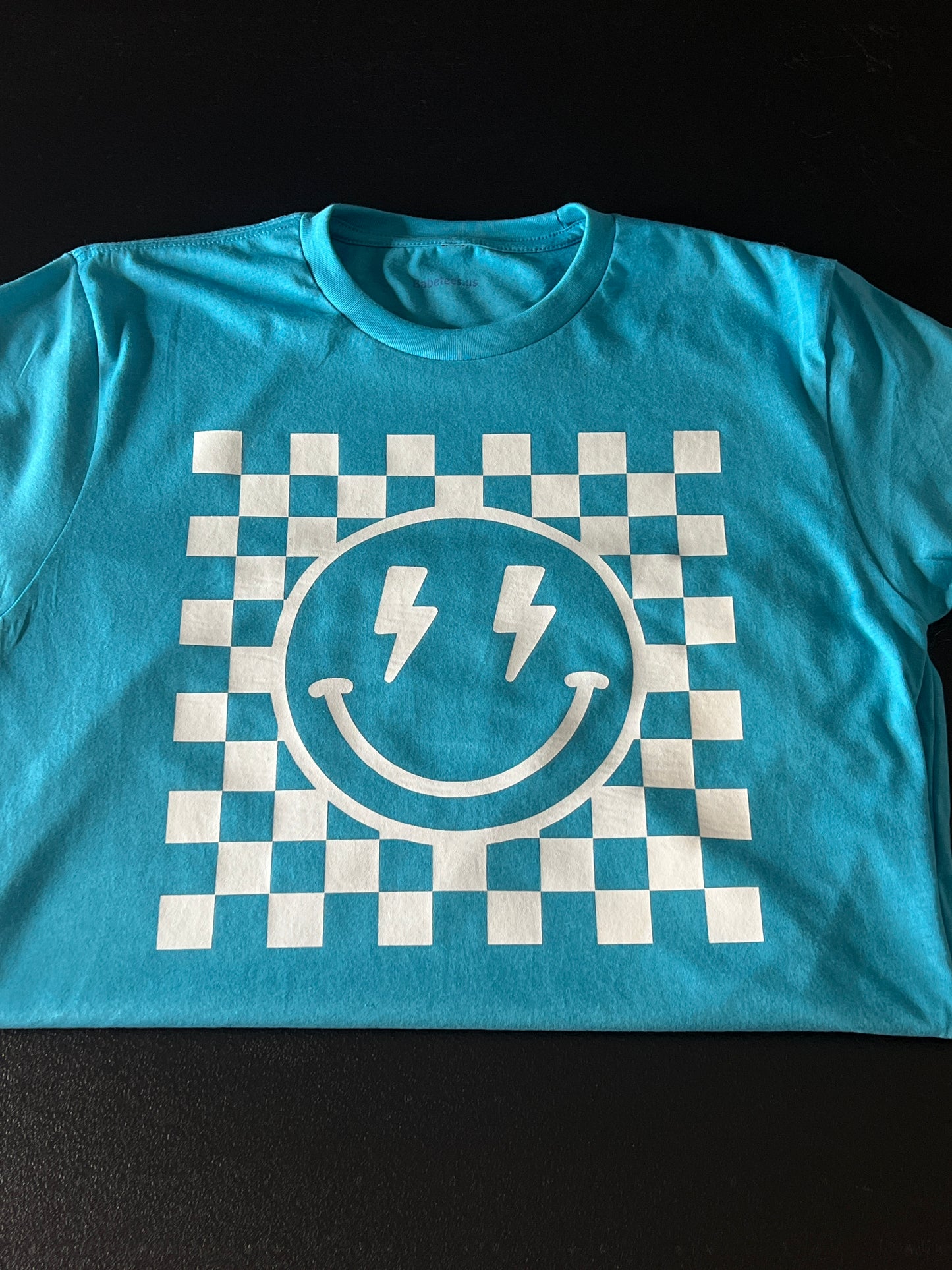 Checkered Smiley lightening face on Blue